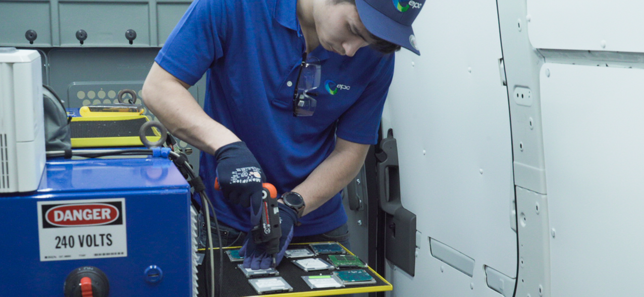 Technician removing chassis from Solid state hard drives